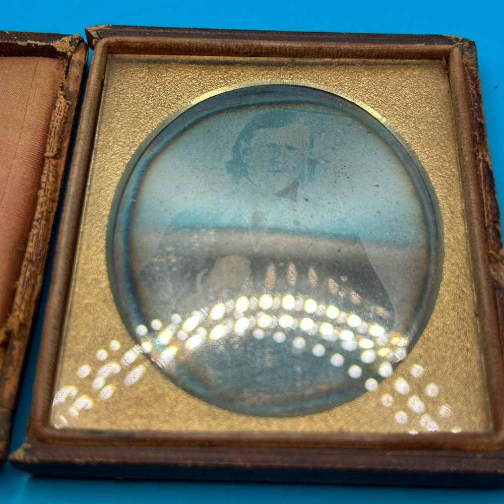 Antique tin type picture in original case, ornate gold, velvet lined